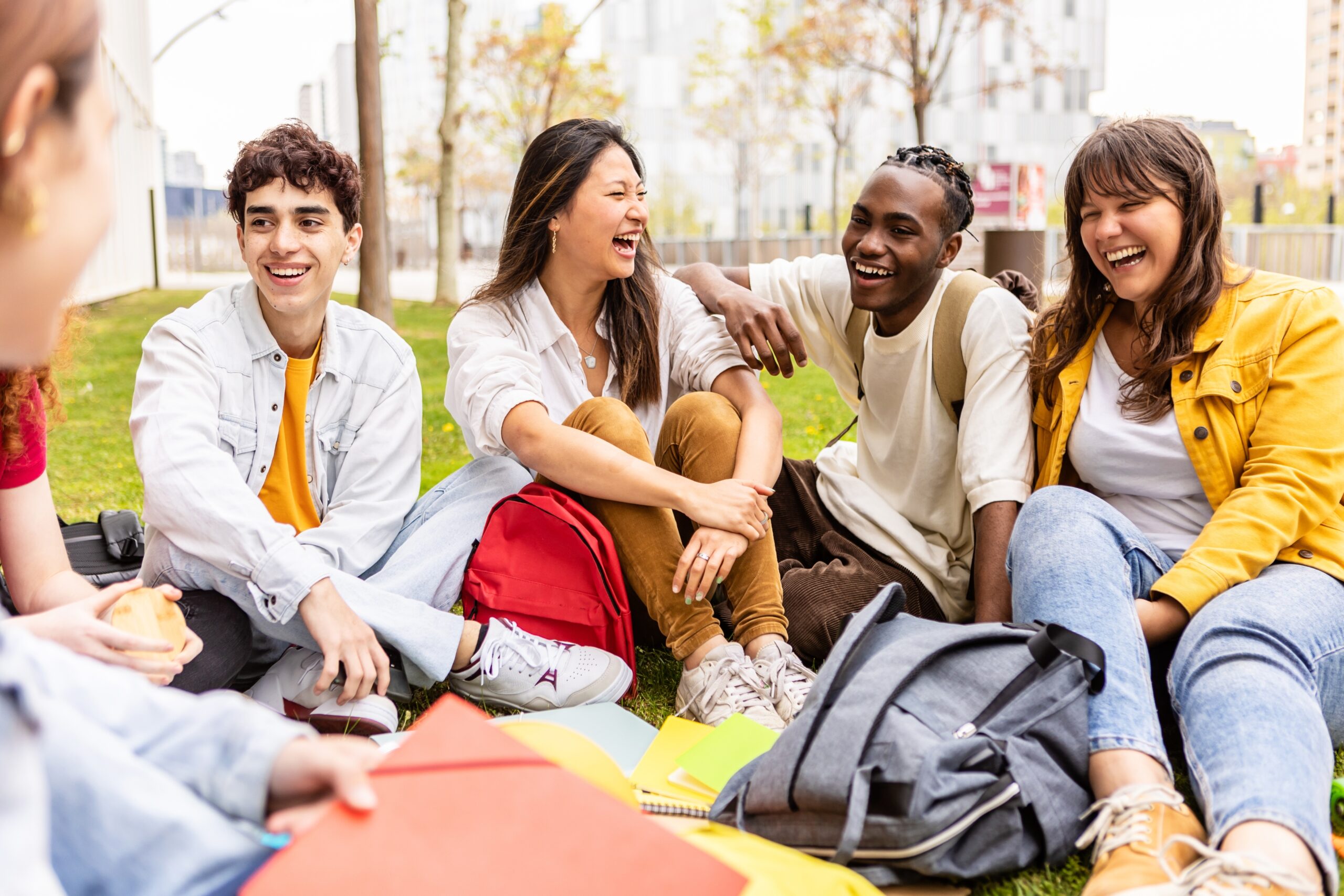 Young,Group,Of,Multiracial,Students,Laughing,And,Having,Fun,Together