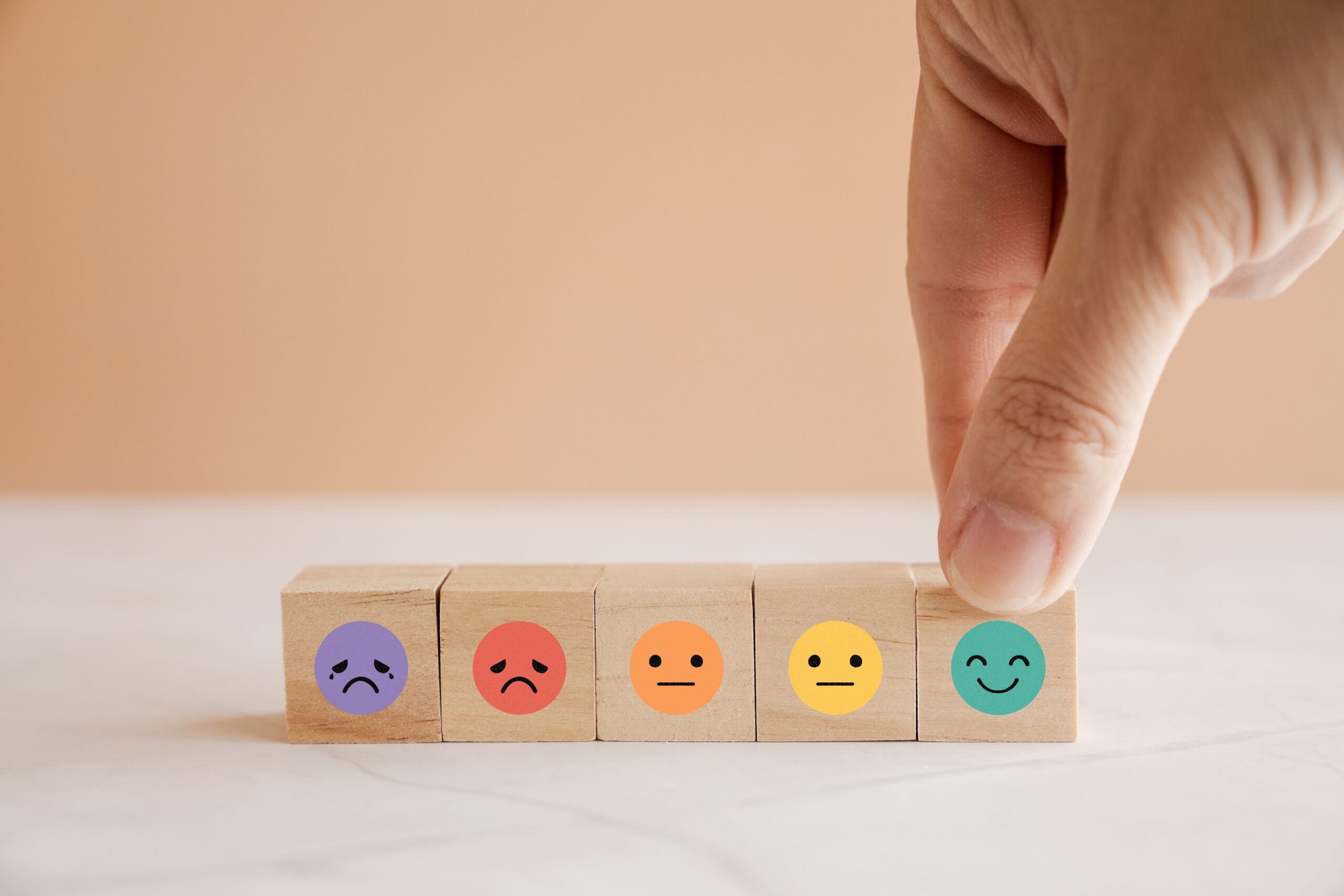 Hand,Choosing,Happy,Smile,Face,Wooden,Block,,Good,Feedback,Rating